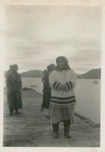 Image of Eskimo [Inuit] women and a baby on a dock